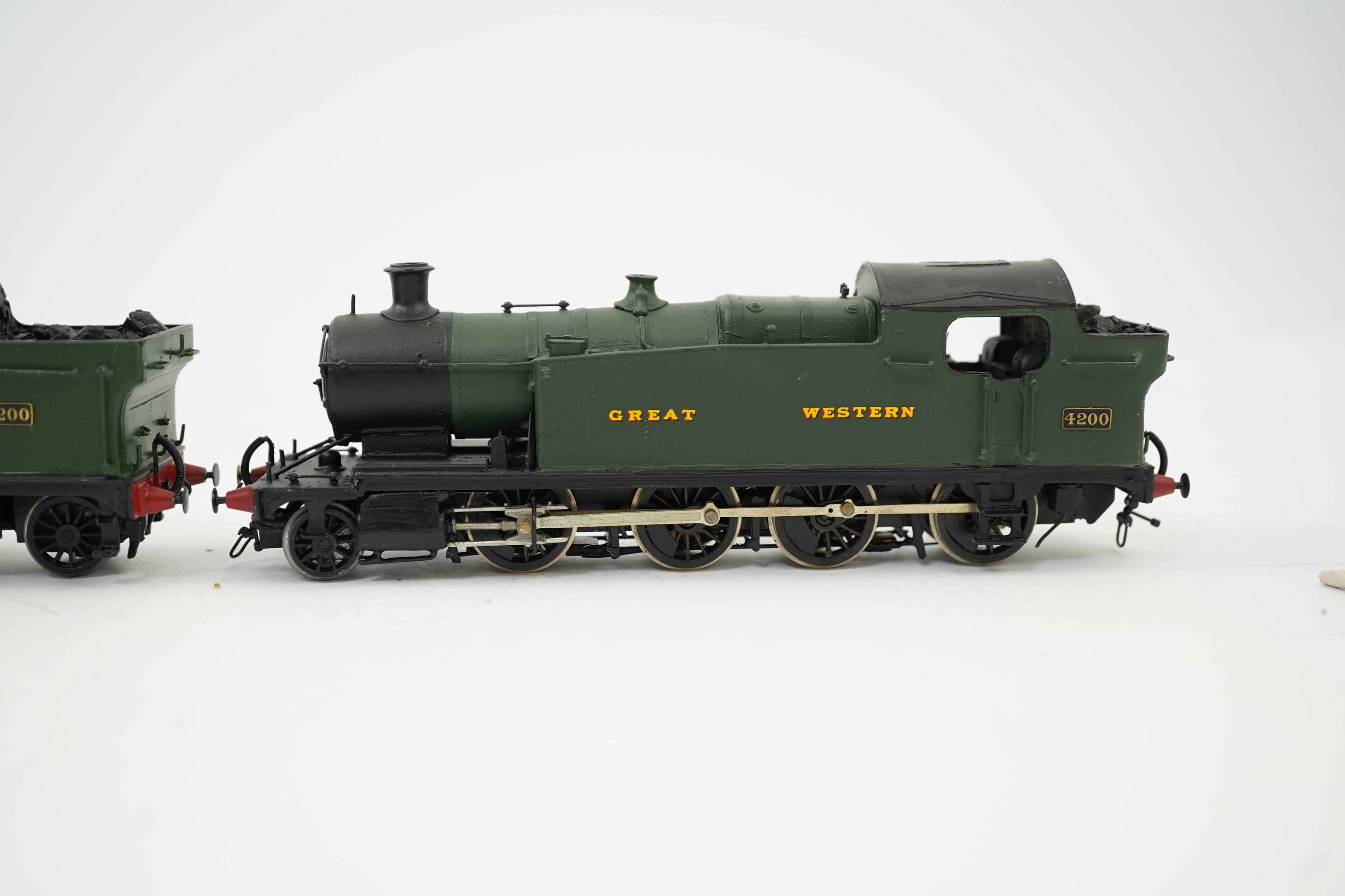 Three 00 gauge kit built GWR tank locomotives, two brass and white metal; a 42xx class 2-8-0T, 4200, together with an 72xx class 2-8-2T, 7200, plus a plastic/resin and metal 22xx class 4-4-2T, 2222, all constructed, pain